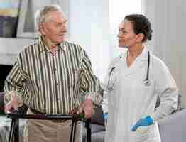 Free photo doctor talking to senior man indoors