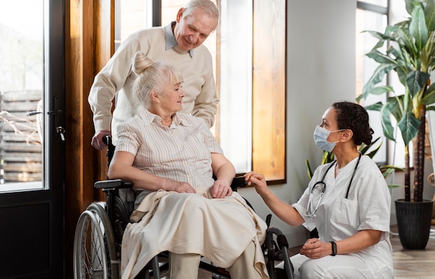 Doctor talking with her elder patient