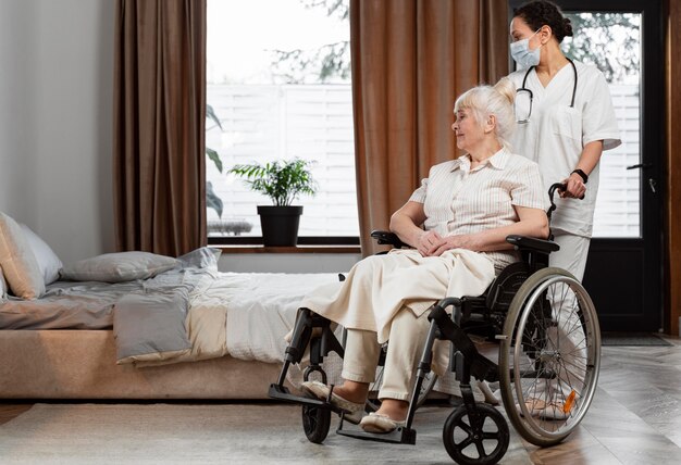 doctor talking with her elder patient