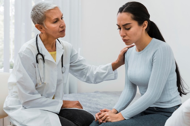 Doctor talking with a sad patient