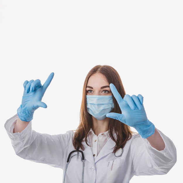Doctor tapping air in gloves
