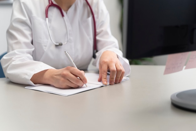 Doctor teleconsulting patient on computer