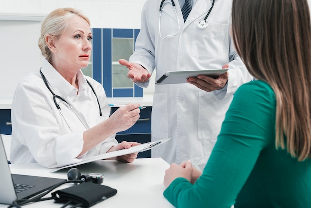 Free photo doctor tending to a patient