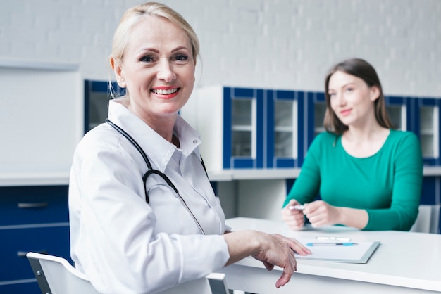 Free photo doctor tending to a patient