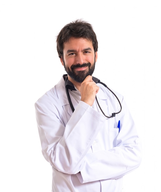 Free photo doctor thinking over isolated white background