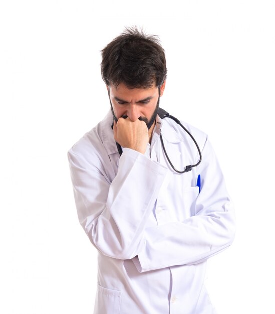 Doctor thinking over isolated white background