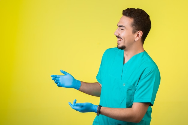 Doctor in uniform and hand mask stopping and asking.