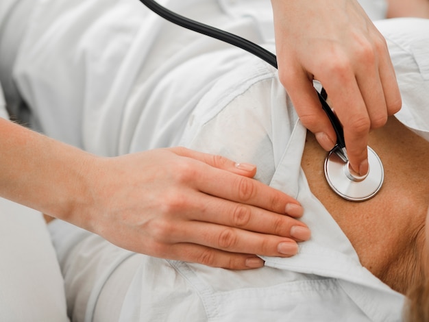 Doctor using a stethoscope