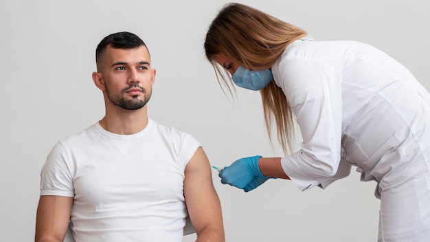 Doctor vaccinating patient