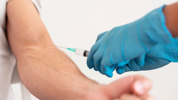 Doctor vaccinating patient