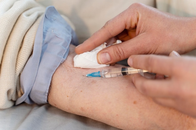 Doctor vaccinating a senior patient