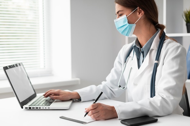 doctor wearing face mask at the clinic