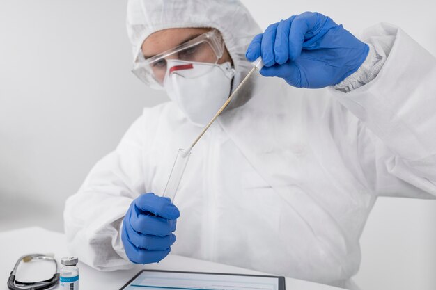 Doctor wearing a face mask and surgical gloves