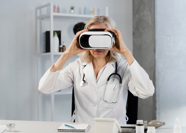 Doctor wearing virtual reality goggles