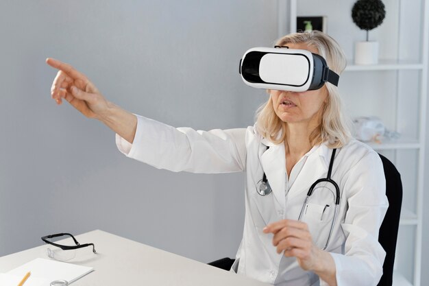 Doctor wearing virtual reality goggles