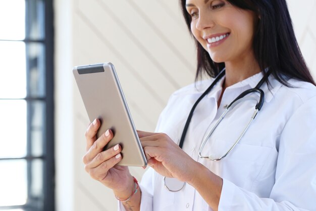 Doctor wearing white robe and stethoscope