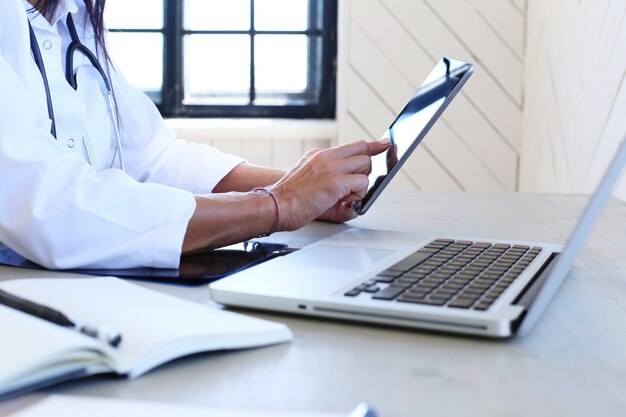 Doctor wearing white robe and stethoscope