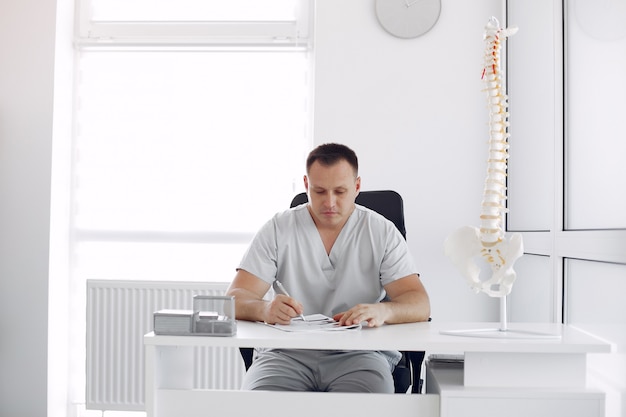 Doctor in a white uniform at the office