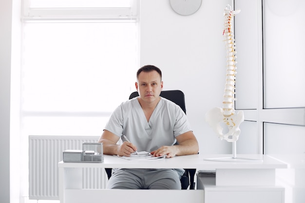 Doctor in a white uniform at the office