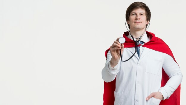 Doctor with cape and stethoscope