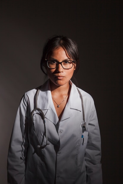 Free photo doctor with dark background