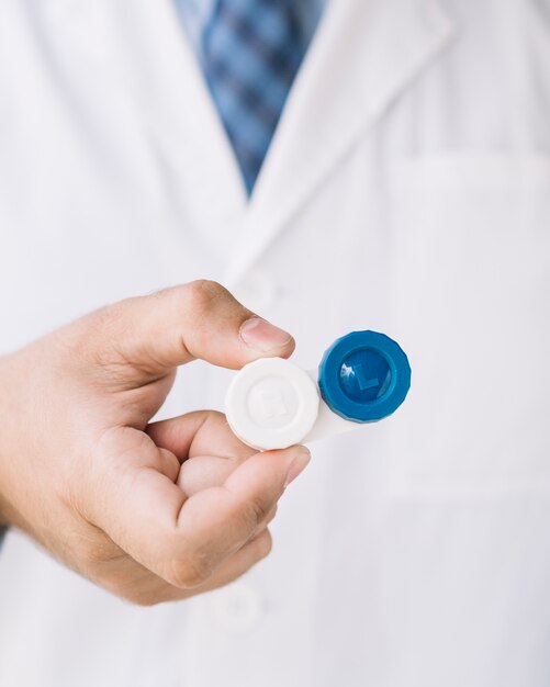 Doctor with holding a pair of contact lenses