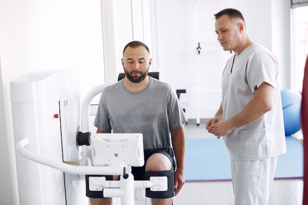 Doctor with a patient in physiotherapy clinic