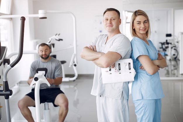 Doctor with a patient in physiotherapy clinic