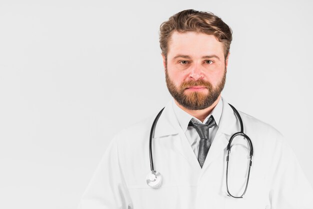 Doctor with serious face looking at camera