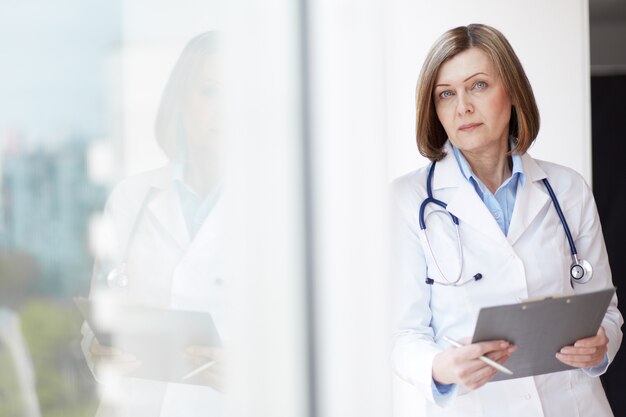 Doctor with stethoscope and clipboard