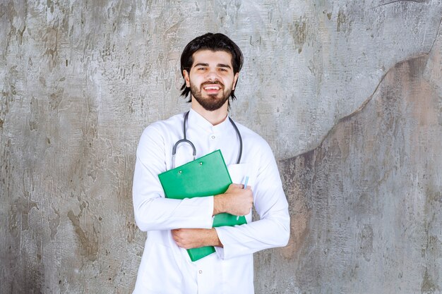 Doctor with a stethoscope presenting the history of a patient