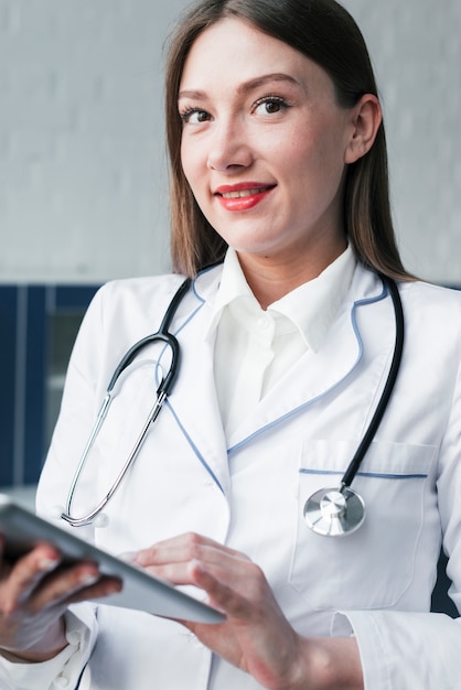 Doctor with a stethoscope and a tablet