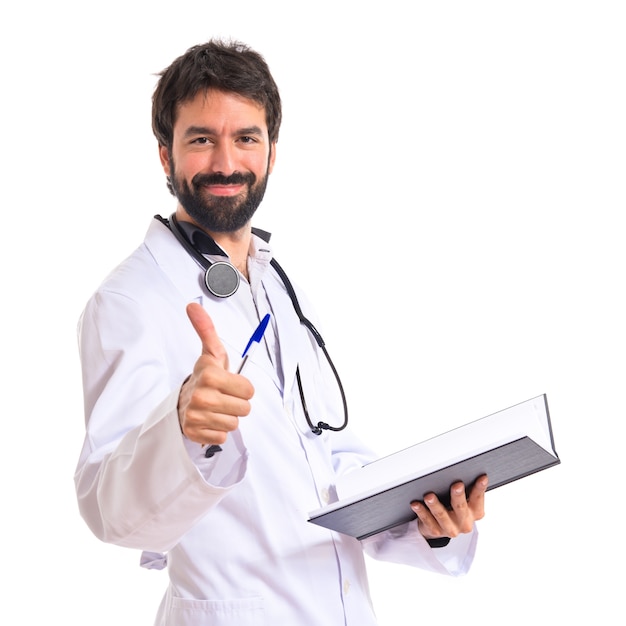 Doctor with thumb up over white background