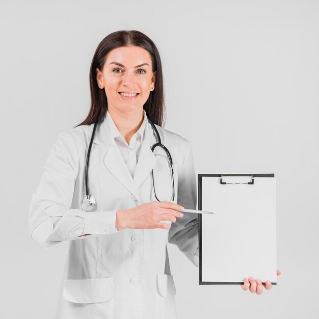 Doctor woman showing on clipboard 