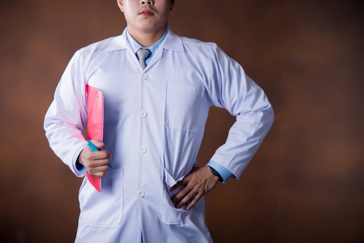 Free Photo doctor working holding a clipboard