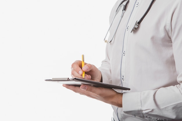 Doctor writing in tablet