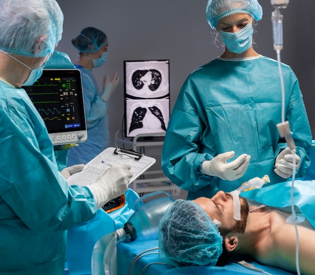 Doctors doing a surgical procedure on a patient