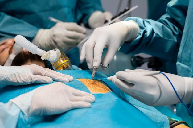 Doctors doing a surgical procedure on a patient