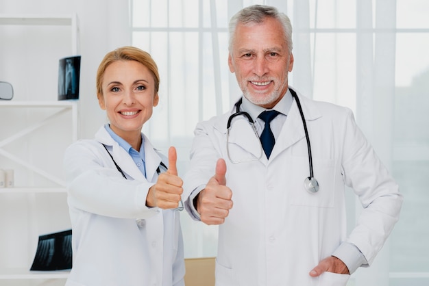 Doctors giving thumbs up
