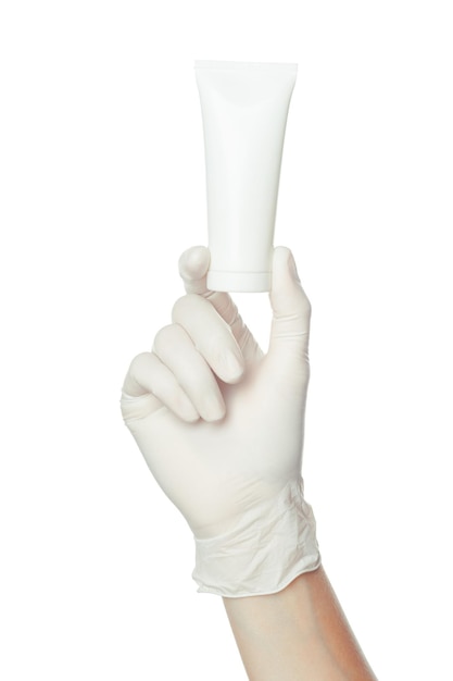 Doctors hand in blue sterilized surgical glove holding medicine