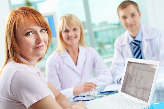 Doctors looking through the medical record