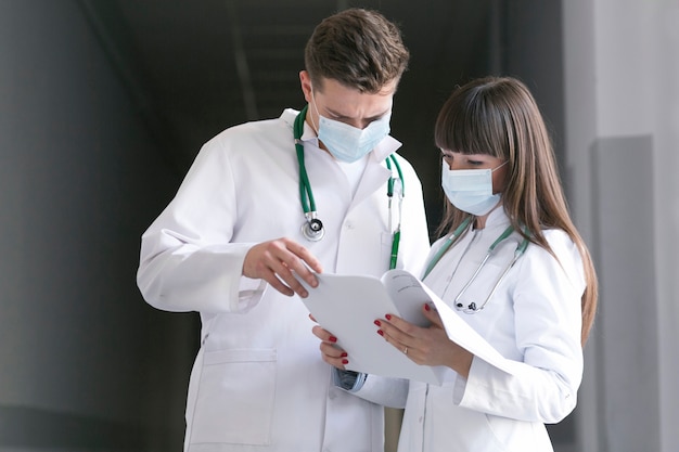 Doctors in masks with documents