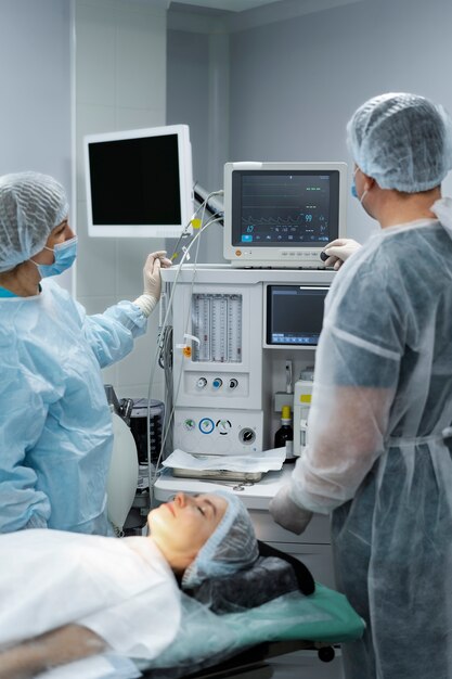 Doctors monitoring the patient's pulse