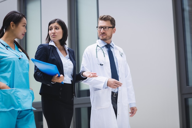 Doctors and nurse interacting while walking