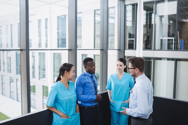 Doctors and nurse interacting with each other