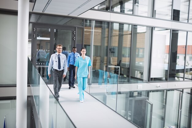 Doctors and nurse walking in corridor