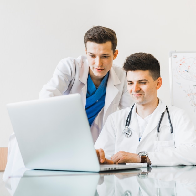 Doctors using laptop