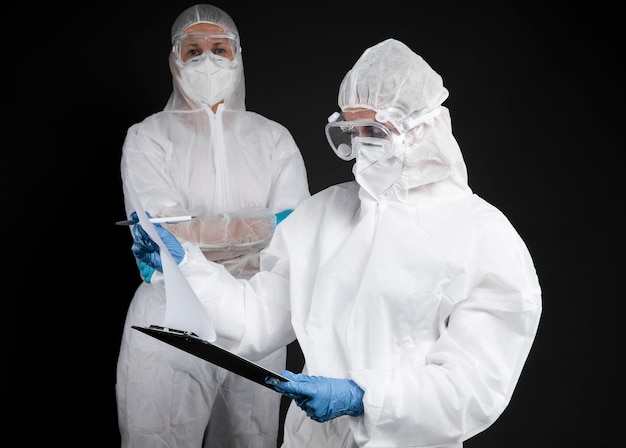 Free photo doctors wearing protective wear