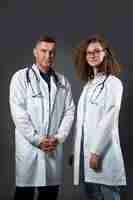 Free photo doctors wearing white coats medium shot