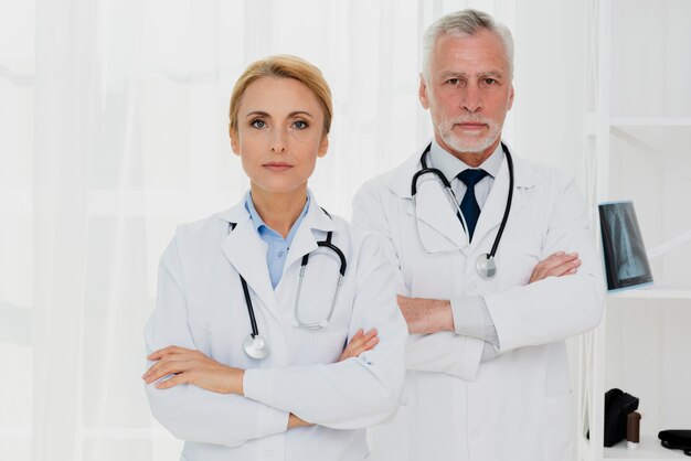 Doctors with crossed hands looking at camera